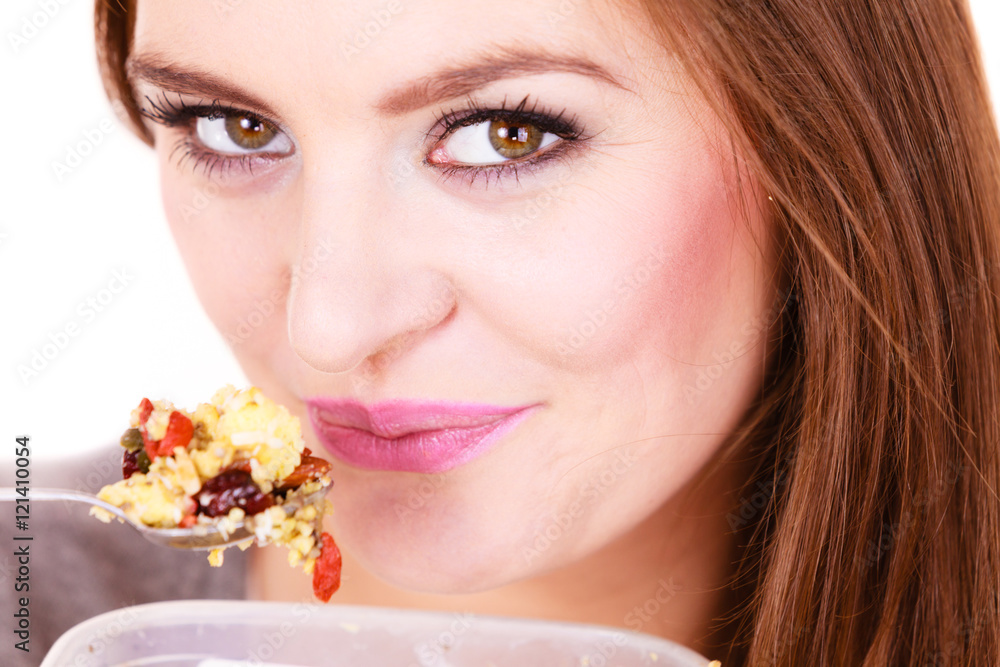 Woman eat oatmeal with dry fruits. Dieting