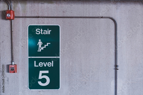 Concrete wall stair sign