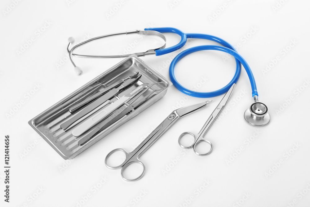 Flat lay of surgery instruments on white background Flat lay of surgery instruments on white background