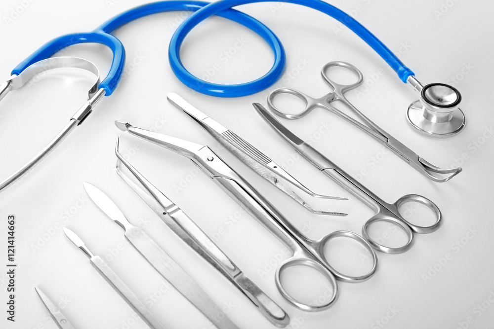 Flat lay of surgery instruments on white background Flat lay of surgery instruments on white background