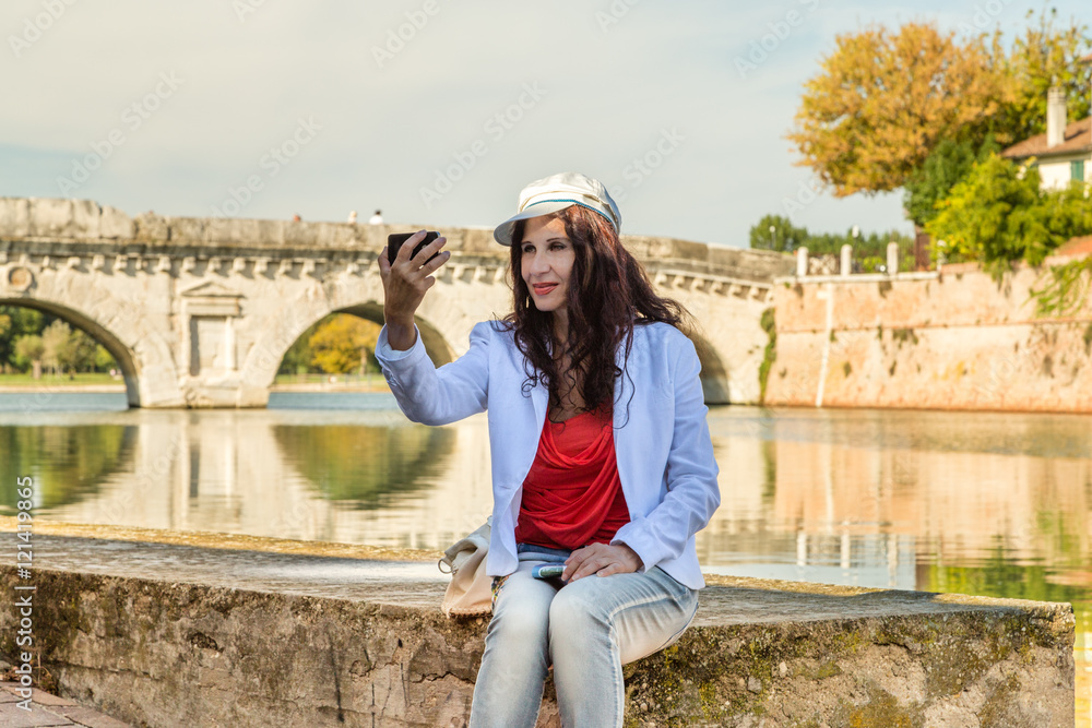 Rimini, Italy, woman taking selfie