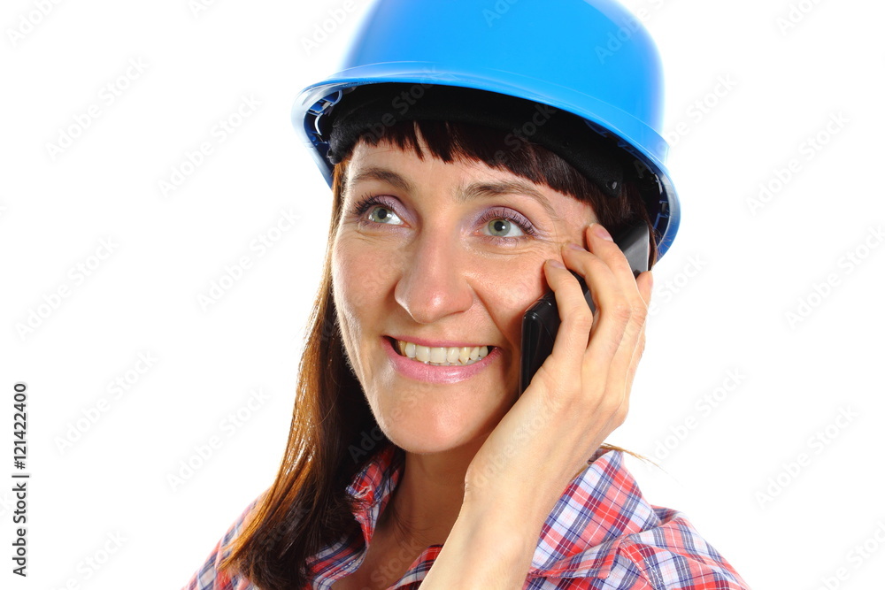 Builder woman in protective helmet talking on mobile phone Builder woman in protective helmet talking on mobile phone