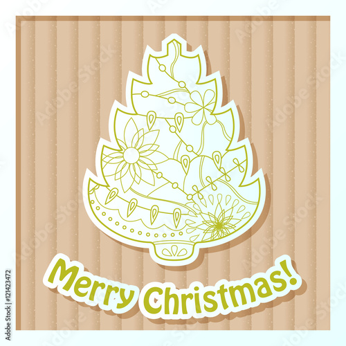 Merry Christmas card on cardboard with tree