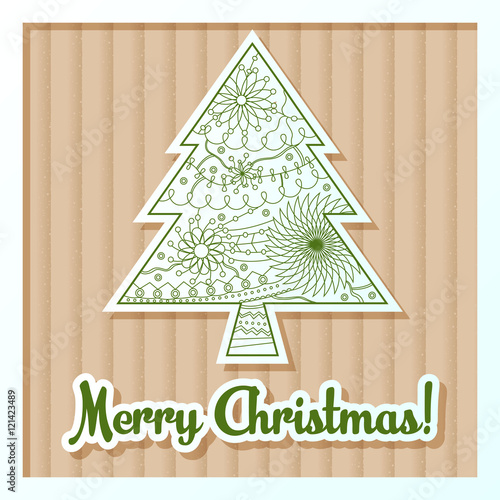 Merry Christmas card on cardboard with tree