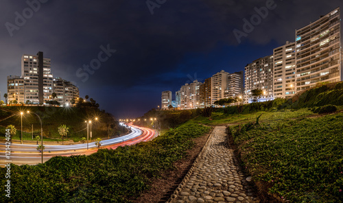 Panoramic night view of the Armendaris downhill and highway in MIraflores, Lima, Peru. photo