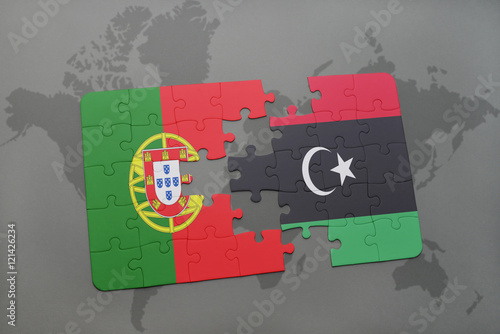 puzzle with the national flag of portugal and libya on a world map background.