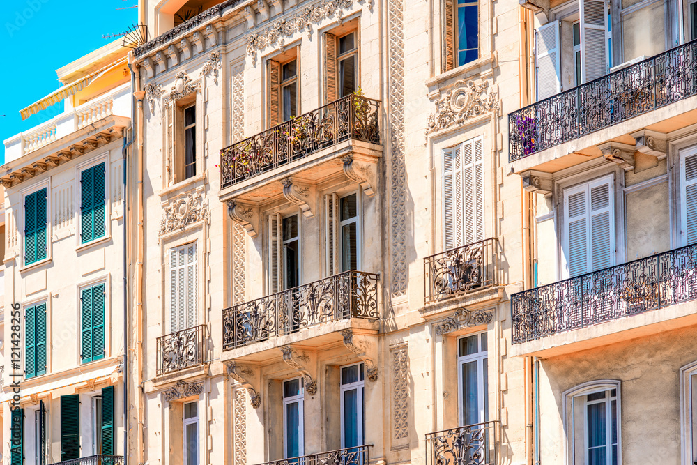 Beautiful residential buildings with colonial architecture in Cannes city in French riviera.