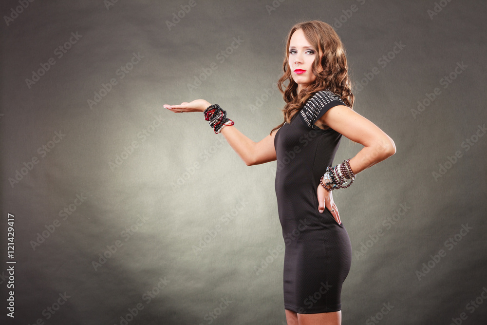 Elegant woman wearing bracelets holds open hand Elegant woman wearing bracelets holds open hand