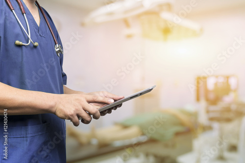 Male doctor,medical students or surgeon using digital tablet and