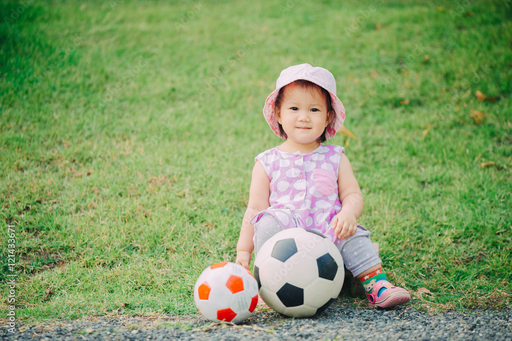 1 year old baby playing soccer football. 1 year old baby playing soccer football.