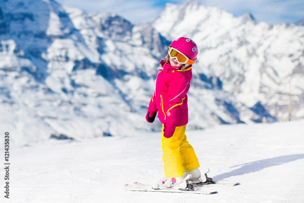 Little child skiing in the mountains