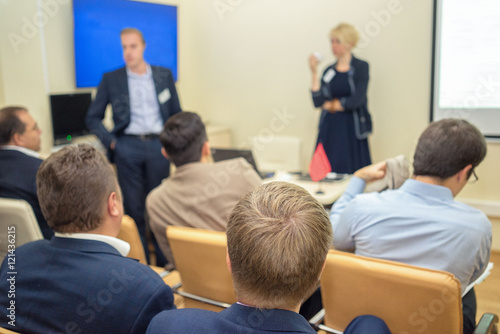 two lecturers talking with audience during business meeting