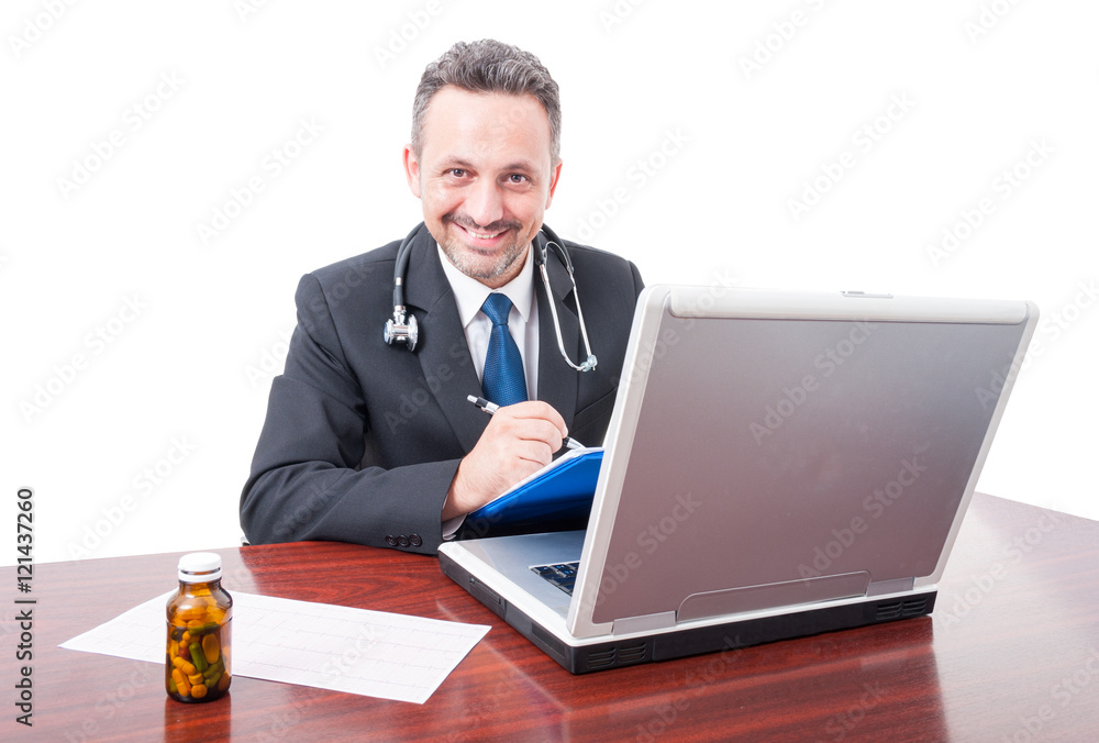 Male medic at office smiling and writing on clipboard Male medic at office smiling and writing on clipboard