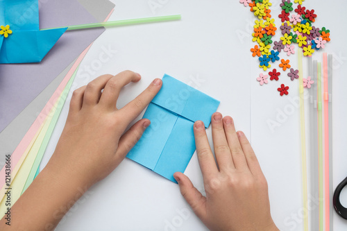 children's hands do origami