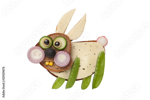 Funny rabbit made of bread and vegetables on isolated background