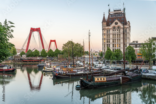Rotterdam City, Oude Haven oldest part of the harbour, historic ship yard dock, Old Ship, Openlucht Binnenvaart Museum, Haringvliet and the Willemsbrug bridge at Dusk in Summer, Netherlands photo