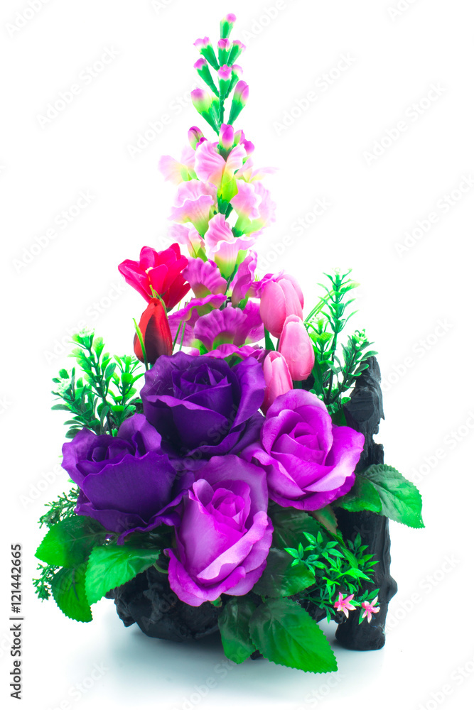 Fototapeta premium Artificial flowers bouquet in the vase isolated on white