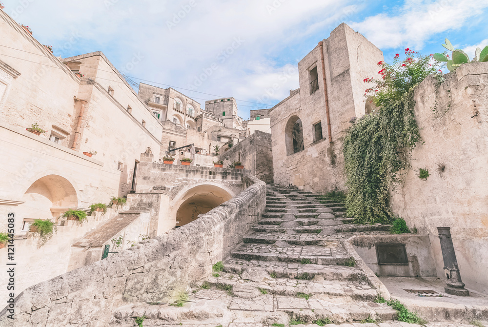 typical old stairs view of Matera under blue sky