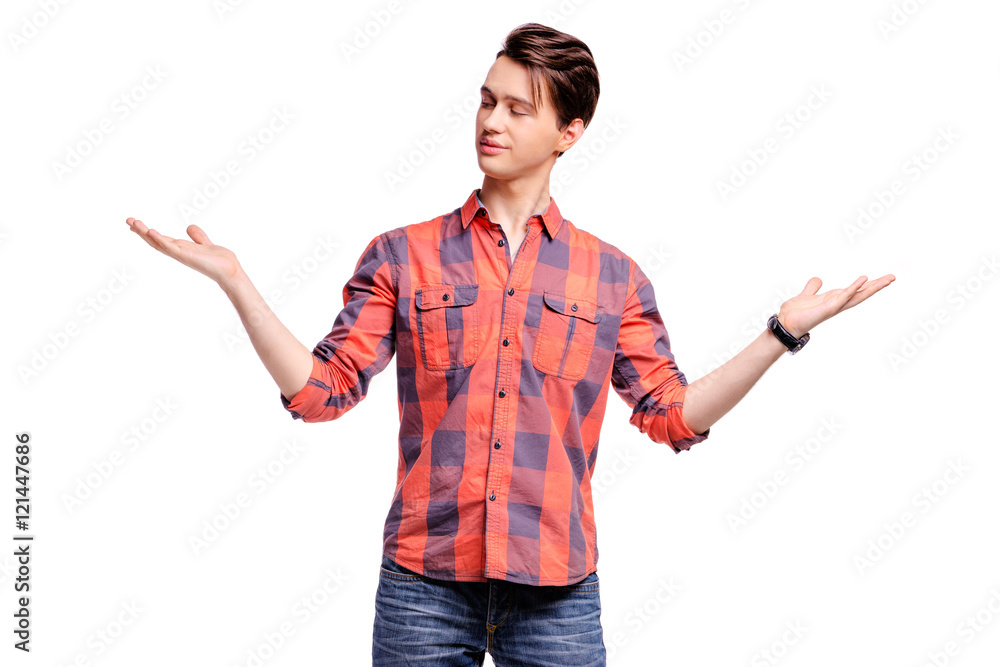 Dilemma. Young man measuring something on the palms of his hands, making a scale with arms. Isolated on white. Dilemma. Young man measuring something on the palms of his hands, making a scale with arms. Isolated on white.