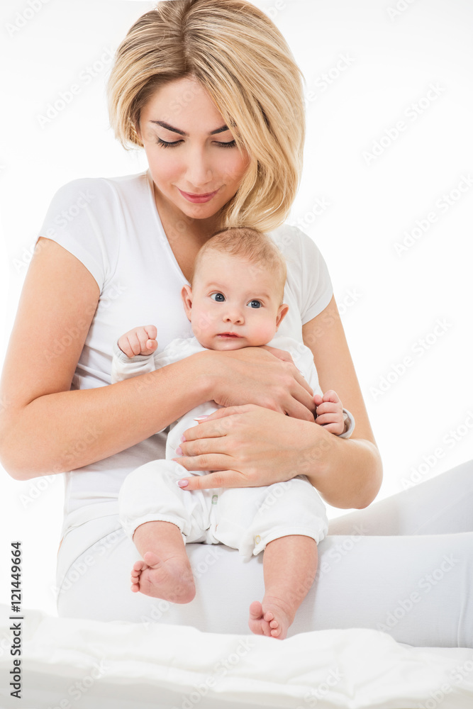 Mother and baby playing and smiling. Happy family. Mother and baby playing and smiling. Happy family.