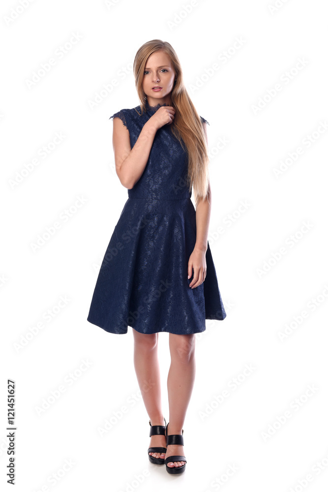 Young pretty long haired blonde woman posing in fashion dress on white background in a studio. Spring summer photo, catalog collection. Young pretty long haired blonde woman posing in fashion dress on white background in a studio. Spring summer photo, catalog collection.