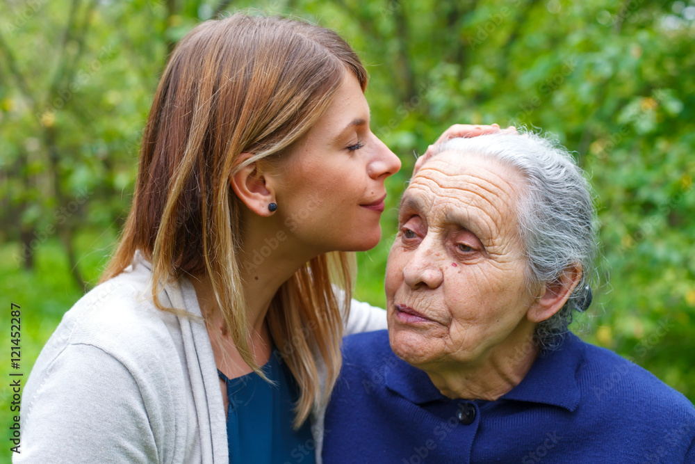 Kissing grandma's forehead