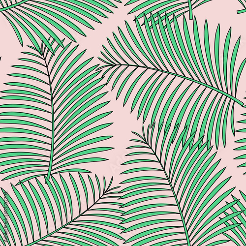 Seamless pattern with palm leaves in green on pastel pink background.