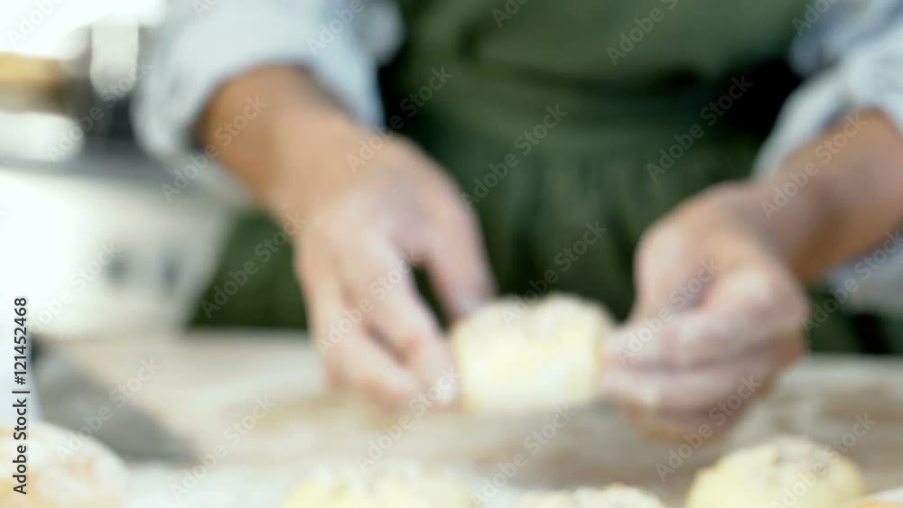 Woman adding grains and showing roll to the camera in the kitchen, dolly shot
Woman adding grains and showing roll to the camera in the kitchen, dolly shot