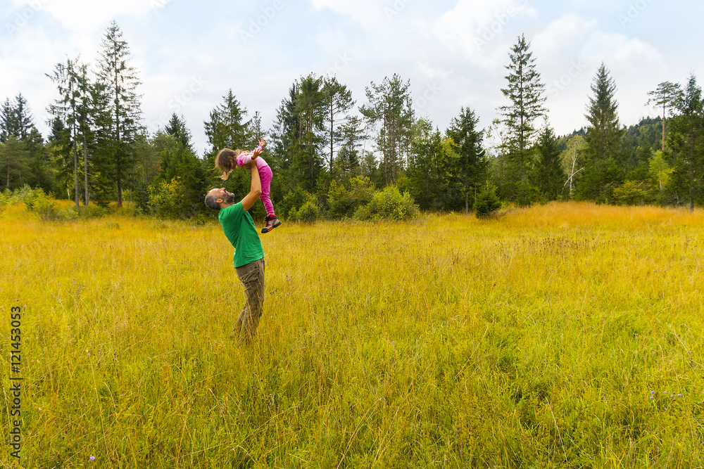 Father and daughter having fun on a beautiful day.