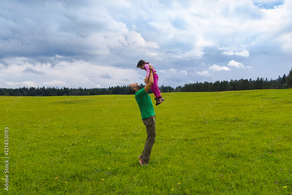 Father and daughter having fun on a beautiful day.