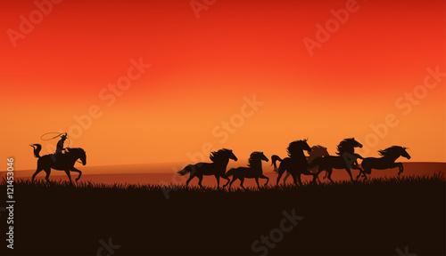 wild west landscape with cowboy chasing mustang horses herd