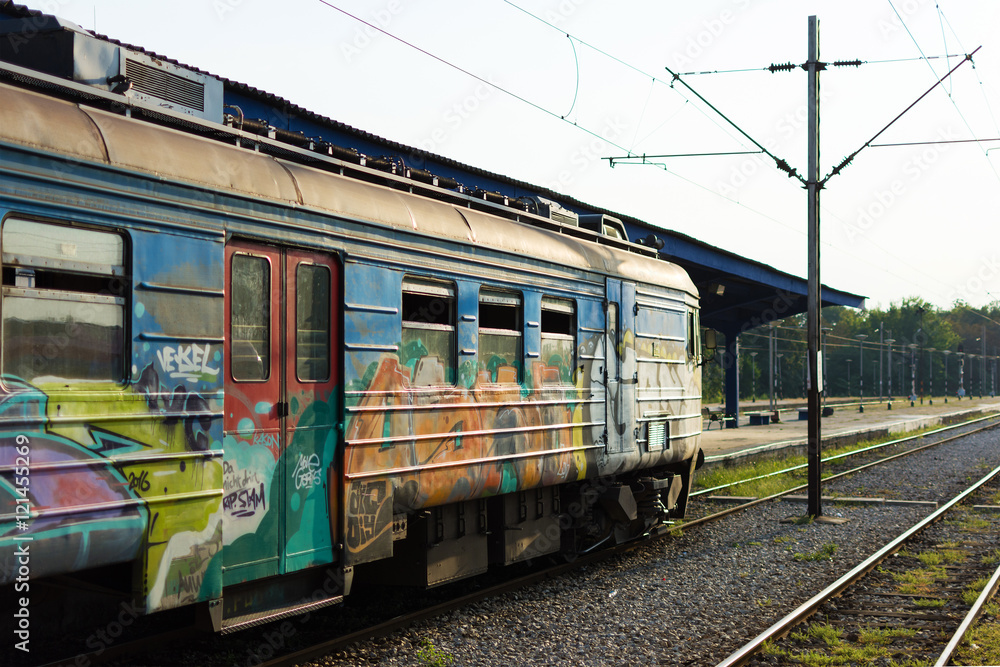 Train With Graffiti Waiting at the Station