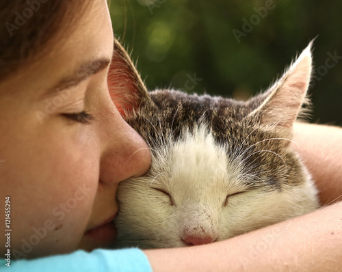 teen girl hug cat close up portrait