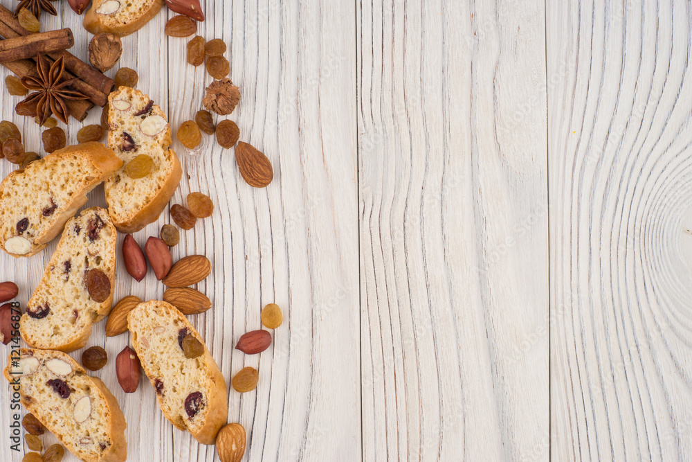 Cookies with almonds and raisins on the old wooden table. Cookies with almonds and raisins on the old wooden table.