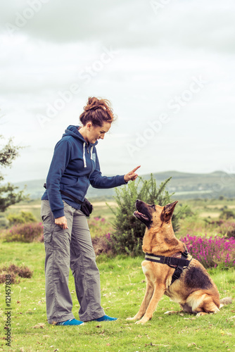 young woman traing big dog