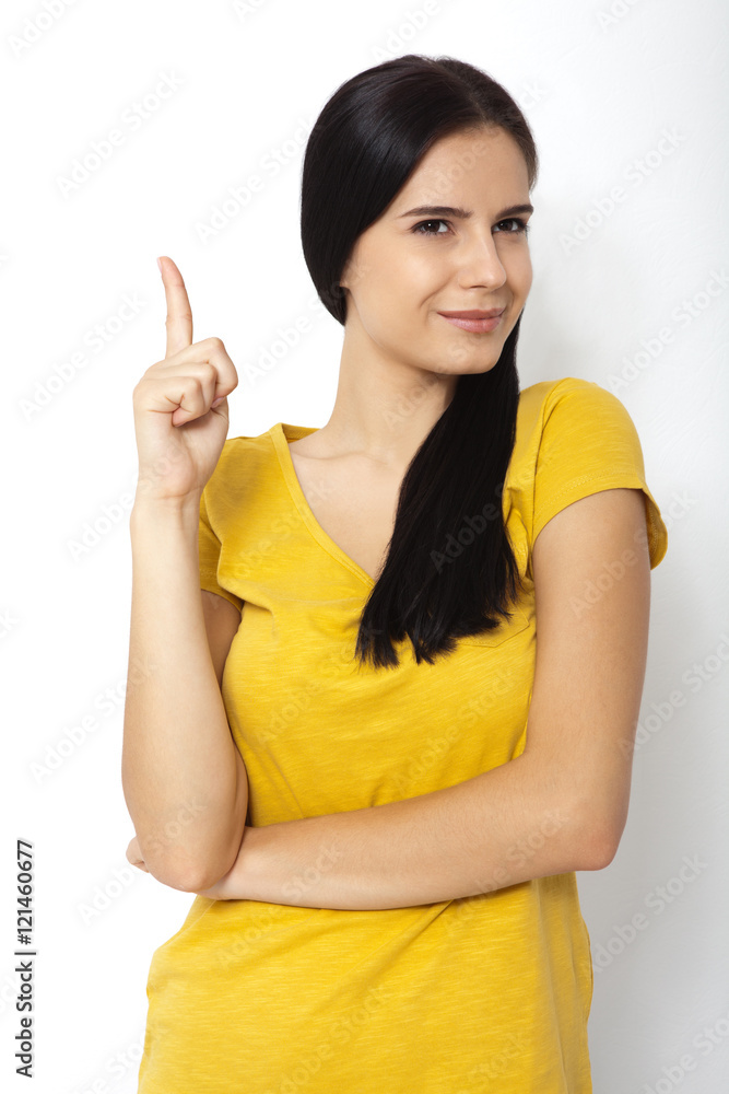 Girl pointing at. Young beautiful woman showing on empty space. Girl pointing at. Young beautiful woman showing on empty space.