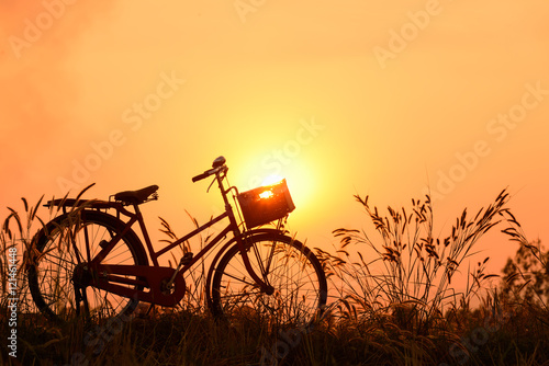 beautiful landscape image with Bicycle at sunset © Looker_Studio