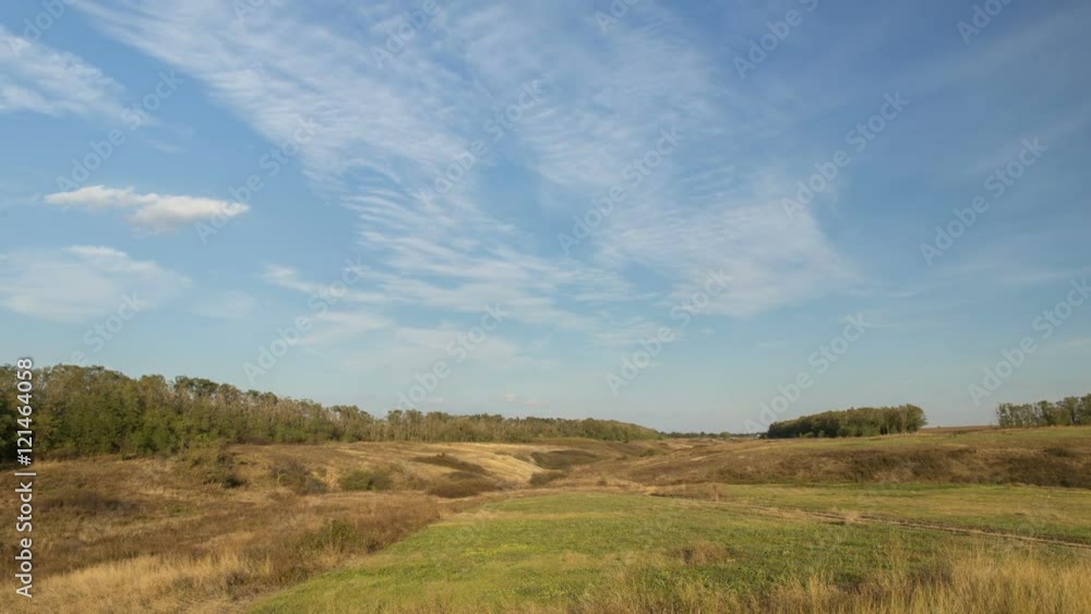 Russia, timelapse. The formation and movement of clouds over autumn endless green fields of grass in the vast steppes of the Don. Russia, timelapse. The formation and movement of clouds over autumn endless green fields of grass in the vast steppes of the Don.