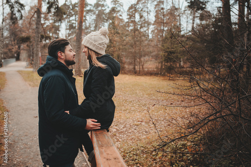 loving young couple happy together outdoor on cozy warm walk in autumn forest
