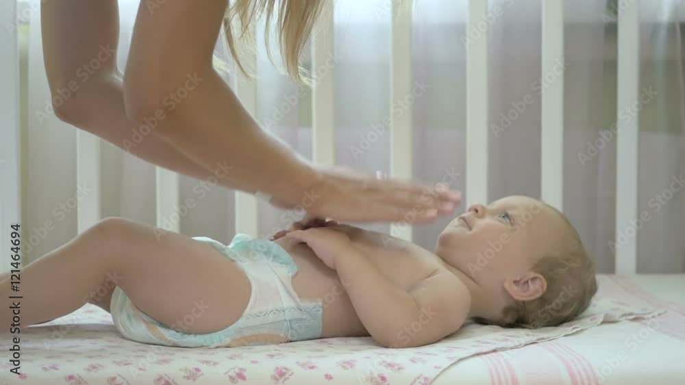 Woman pouring cream from a bottle on hand. Woman pouring cream from a bottle on hand.