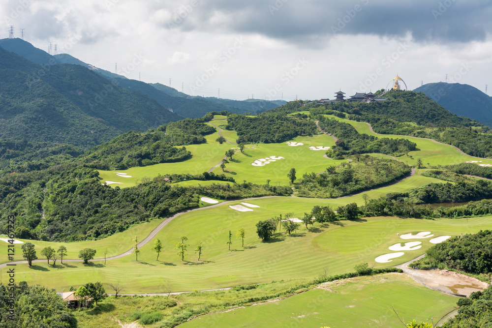 Green golf field on the hills in Overseas Chinese Town East (OCT East ), Shenzhen, China.
