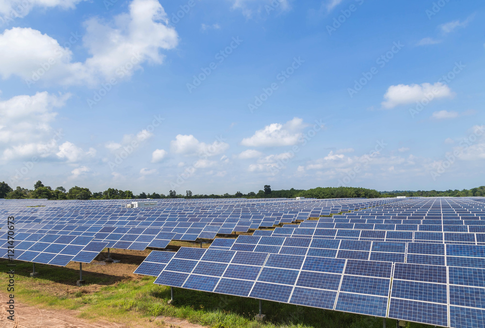 solar panels in solar power station on blue sky background solar panels in solar power station on blue sky background