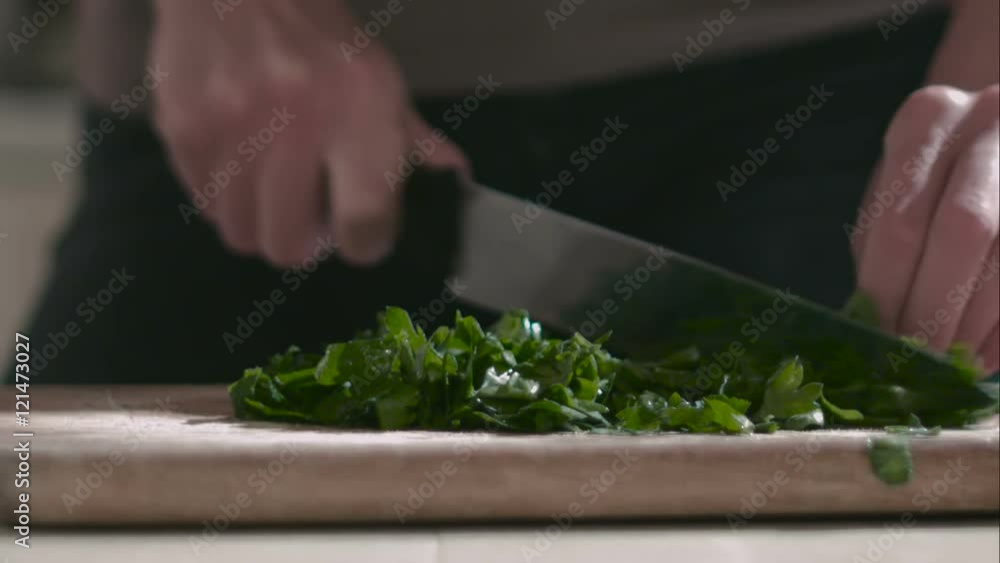 Woman prepares salad on the cutting board Woman prepares salad on the cutting board