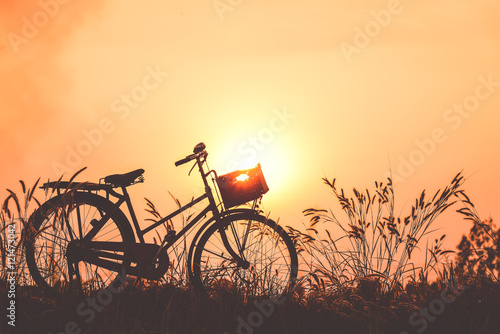 Fototapeta Naklejka Na Ścianę i Meble -  beautiful landscape image with Bicycle at sunset