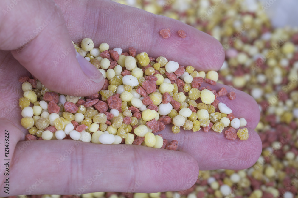 A mineral fertilizer - yellow background. A mineral fertilizer - yellow background.
