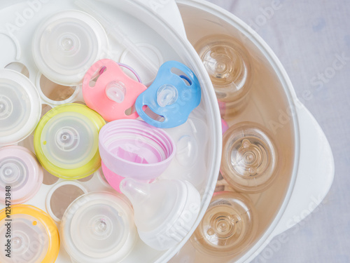 Wallpaper Mural team sterilizer and dryer sterilize baby accessories. Nipple teether. Torontodigital.ca