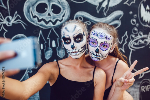 Photos Two girls going on Halloween, grimace and make selfie