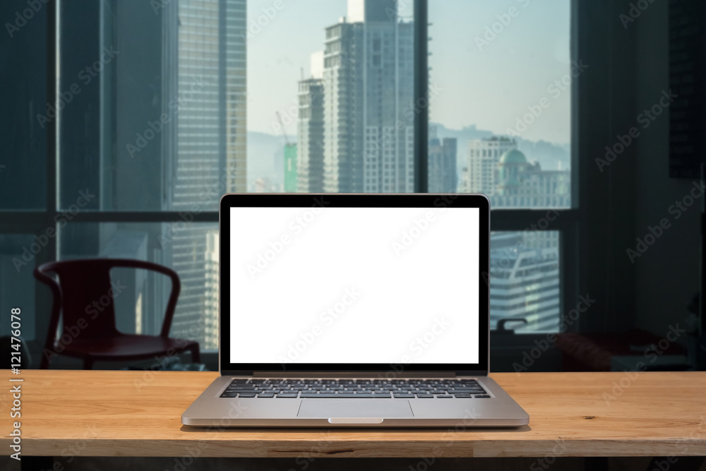 Laptop with blank screen on table. Laptop with blank screen on table.