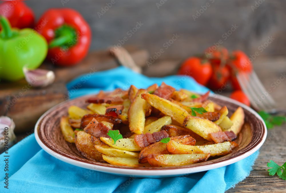 Young fried potatoes with bacon and onions Young fried potatoes with bacon and onions