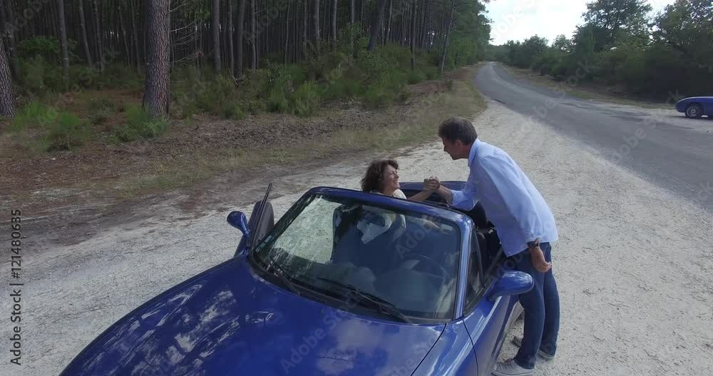 Man and woman in a convertible car lovers Man and woman in a convertible car lovers